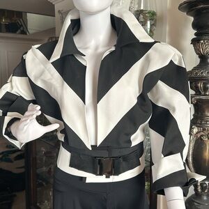 Short jacket with attached belt. Black and white stripe .